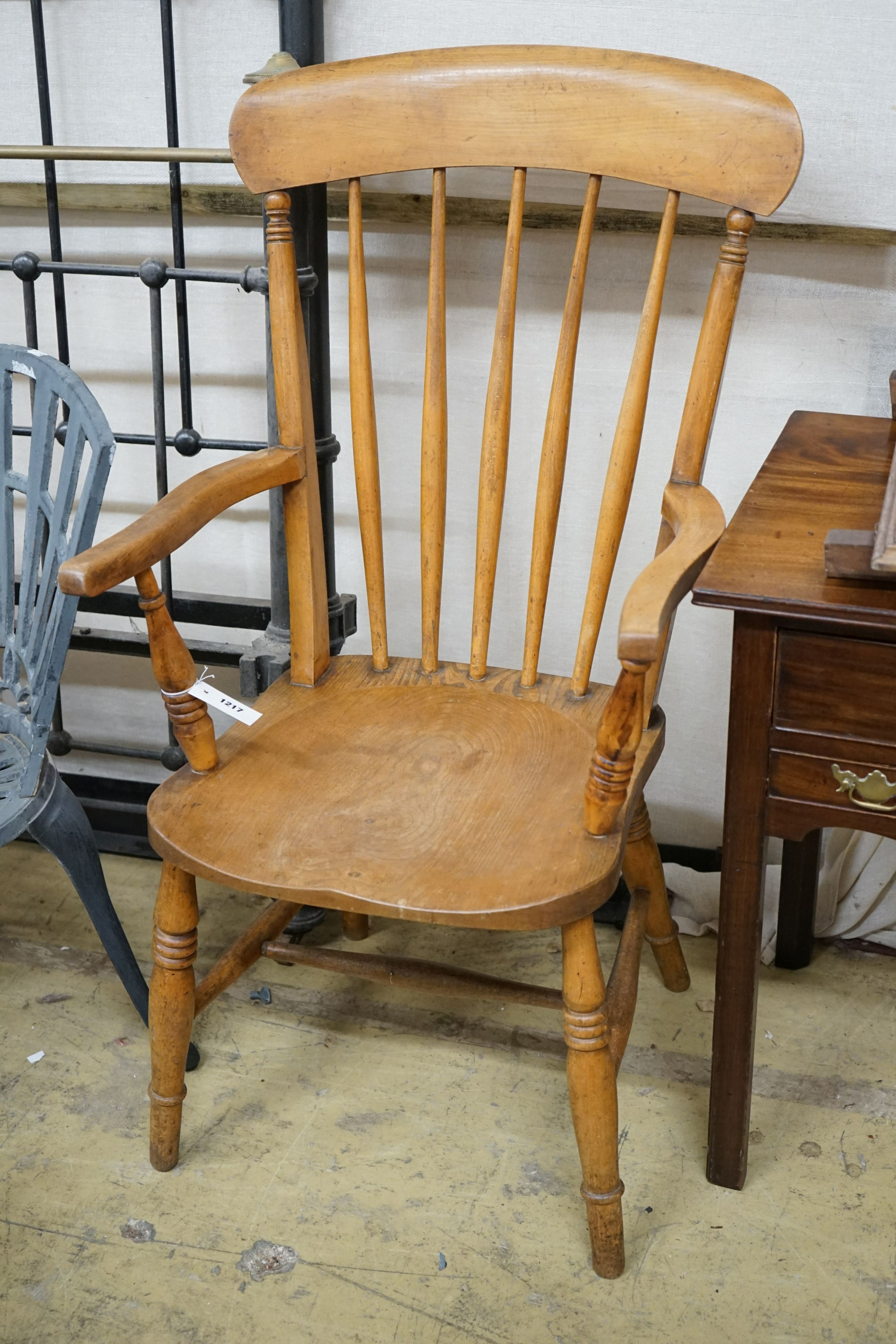 A pair of late Victorian elm and beech Windsor comb back armchairs, width 56cm, depth 47cm, height 112cm